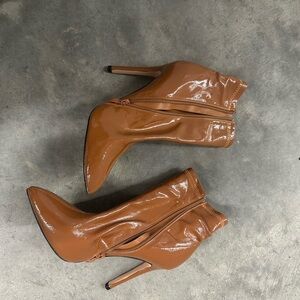 Paten leather ankle boots. New never worn . Pointed toe side zipper aprox 3 herl